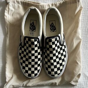Vans Classic Slip-On Checkerboard shoes in black and white canvas